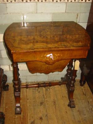 Appraisal: A VICTORIAN WALNUT WORK TABLE of rounded oblong form with