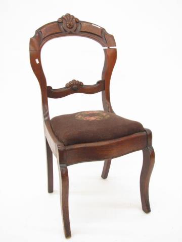 Appraisal: A Victorian walnut side chair with needlepoint seat