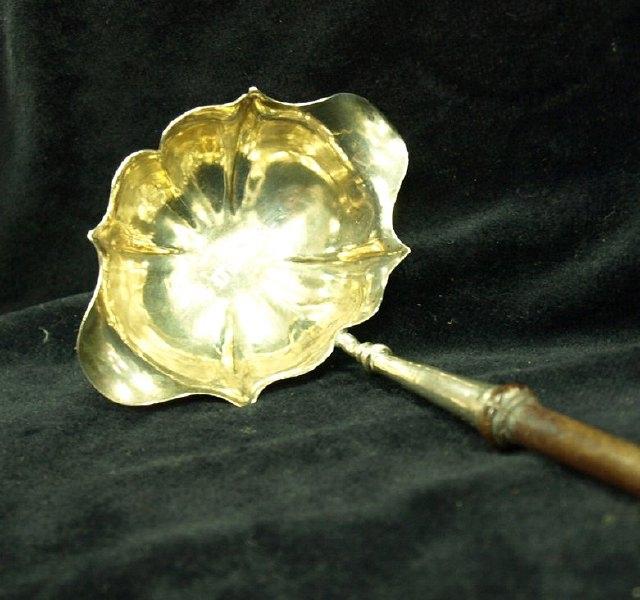 Appraisal: A George II toddy ladle with turned handle