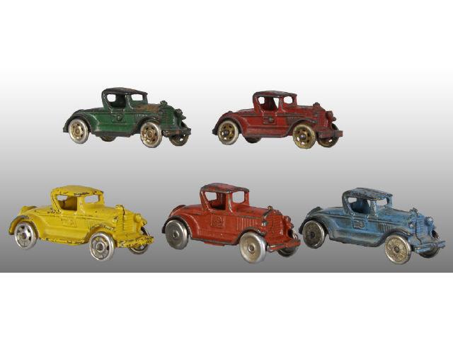 Appraisal: Lot of Cast Iron Coupe Car Toys Description One by