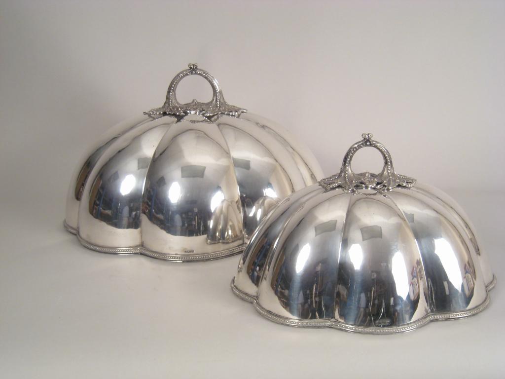 Appraisal: Two Victorian plated shaped oval graduated Meat Covers with finely