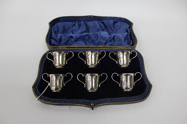 Appraisal: A CASED SET OF SIX SILVER TWO HANDLED CUPS each