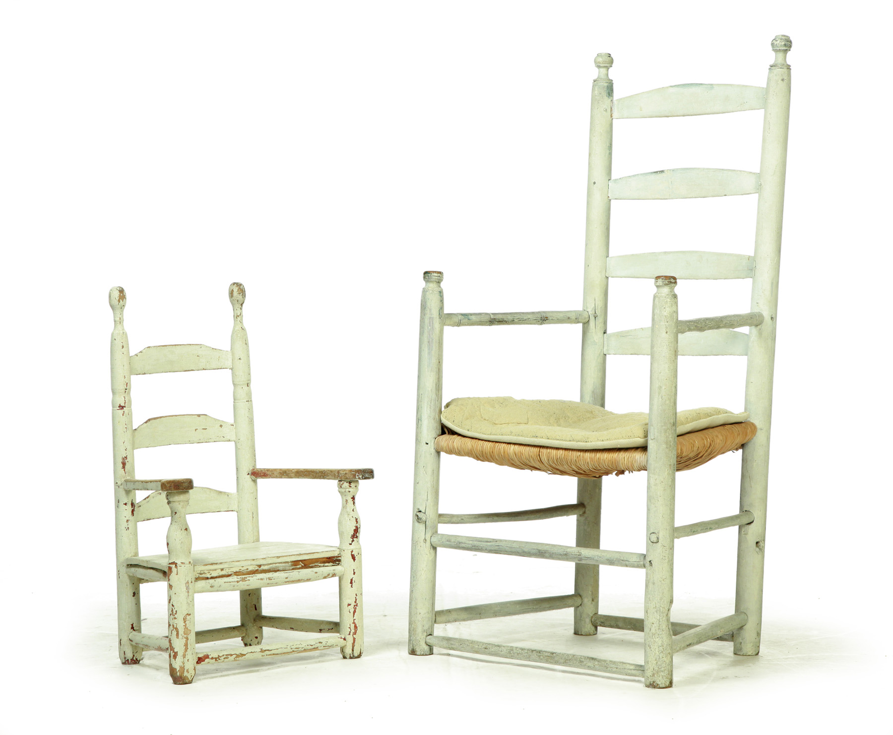 Appraisal: TWO LADDERBACK ARMCHAIRS Second half- th century mixed woods Both