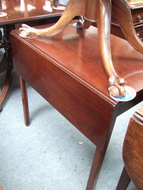 Appraisal: A mid th century mahogany drop flap table raised on