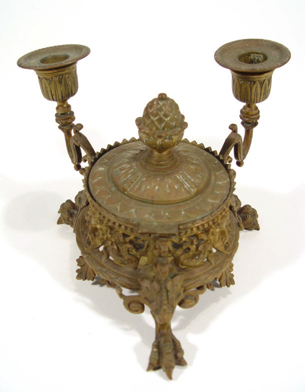 Appraisal: Brass desk stand fitted with two candlesticks supported by scrolled