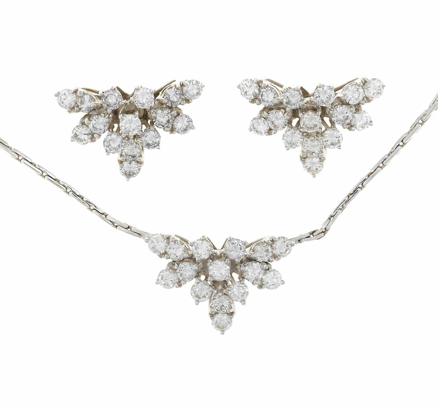 Appraisal: A diamond cluster pendant necklace together with a matching pair