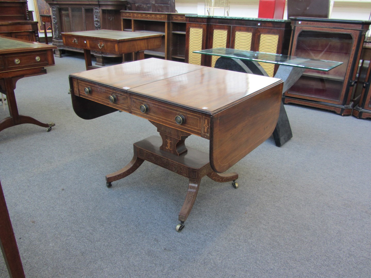 Appraisal: A Regency mahogany two drawer sofa table on crescent mount