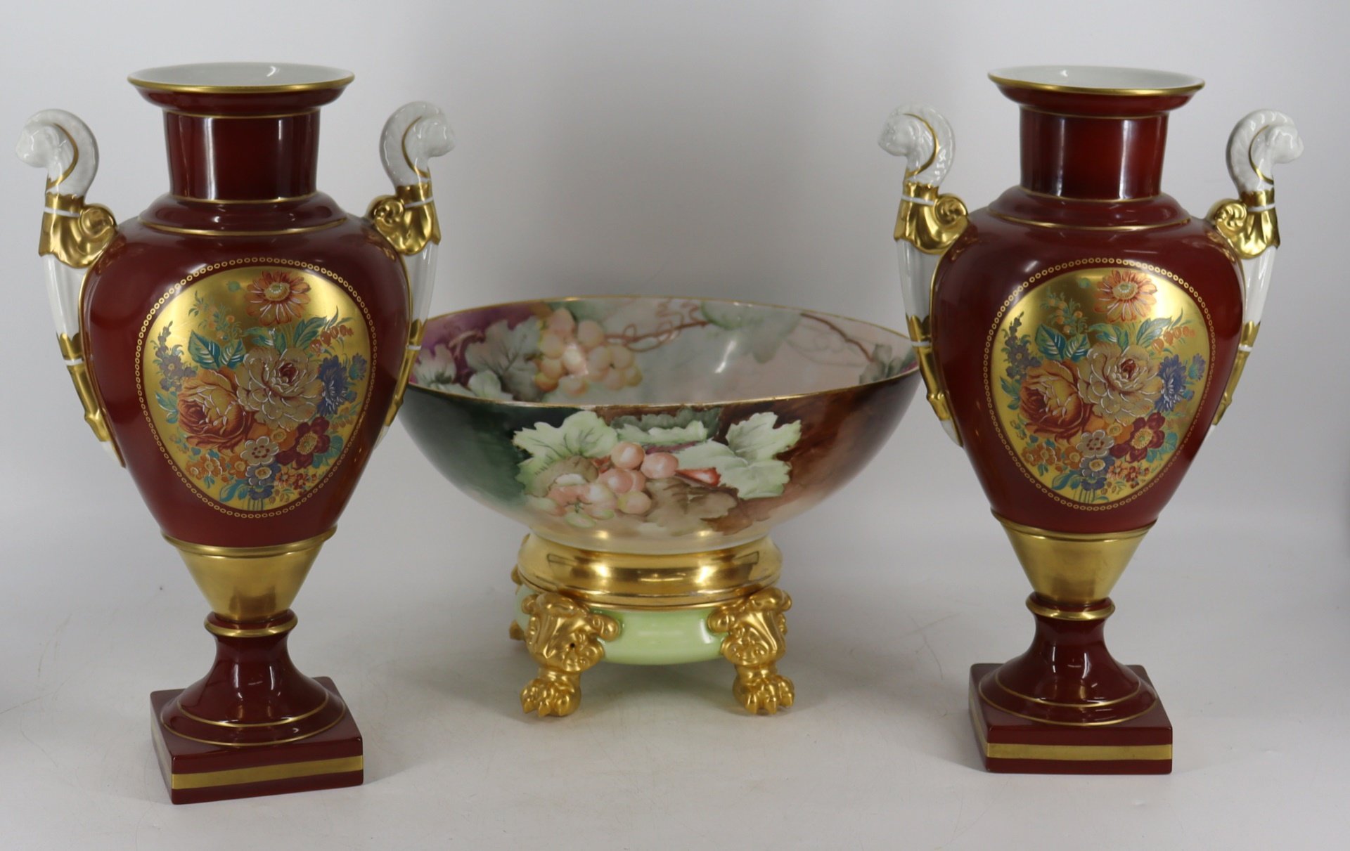 Appraisal: LIMOGES PORCELAIN BOWL ON STAND A PAIR OF Porcelain Urns