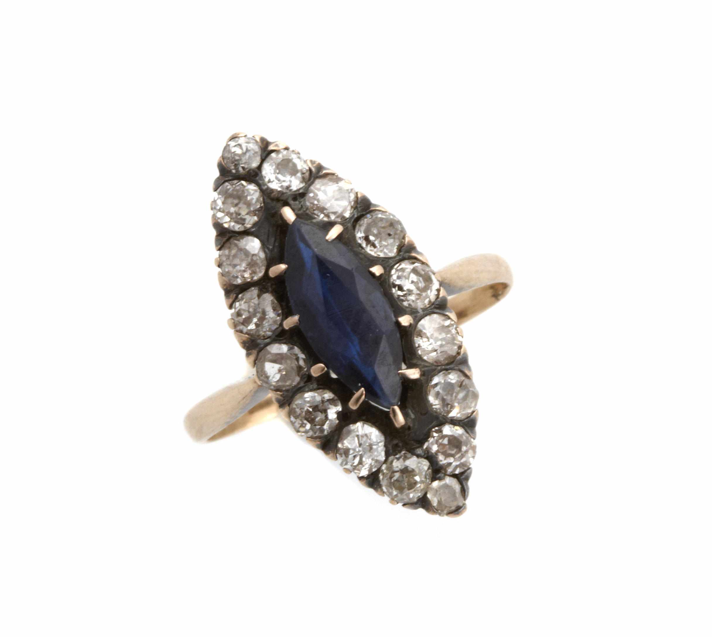 Appraisal: A sapphire diamond and silver-topped gold ring size