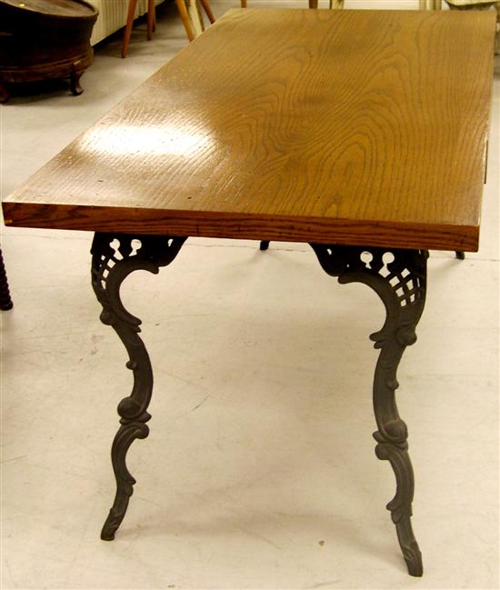 Appraisal: Oak rectangular top wooden table on cast iron metal base