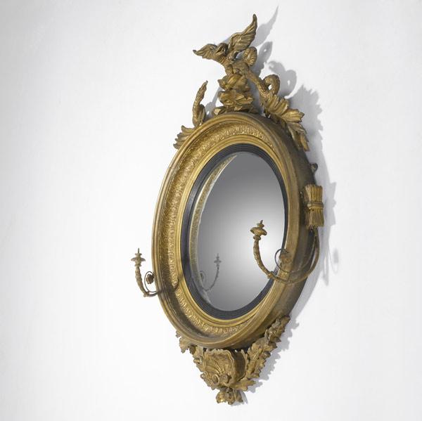 Appraisal: ENGLISH GIRANDOLE MIRROR With ornate decoration and elaborate eagle finial