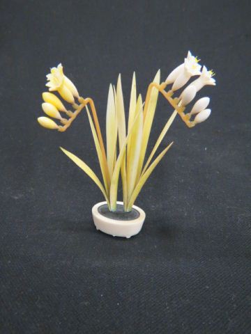 Appraisal: Carved Ivory Figurine of a Flower in planter colorful polychrome