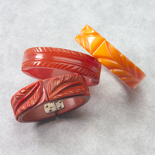 Appraisal: Three Bakelite clamper bracelets glazed rust with incised leaf design