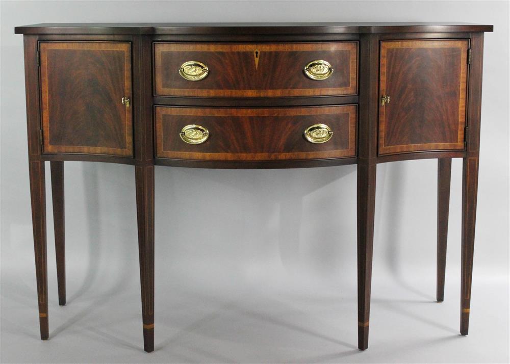 Appraisal: HENKEL HARRIS SHERATON STYLE MAHOGANY SIDEBOARD shaped top above a