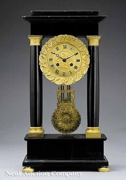 Appraisal: A French Gilt Bronze and Marble Portico Clock th c