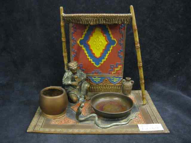 Appraisal: Cold Painted Bronzed Sculpture of Arabicman with cobra '' tall