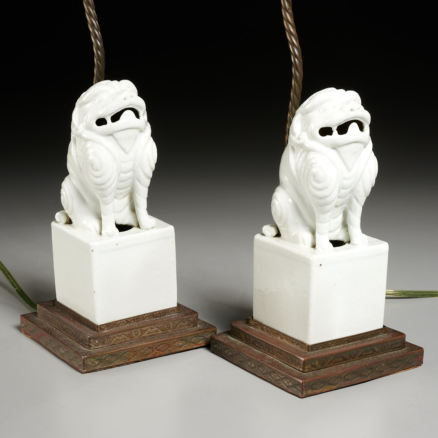 Appraisal: PAIR CHINESE PORCELAIN FOO LIONS MOUNTED AS LAMPS th th