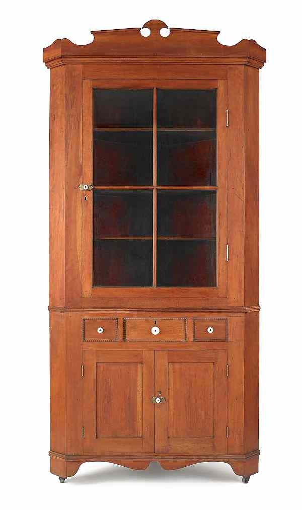 Appraisal: Pennsylvania Federal cherry two-part corner cupboard early th c h