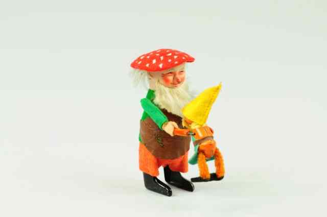 Appraisal: GNOME WITH CHILD Schuco Germany clockwork driven wears green felt