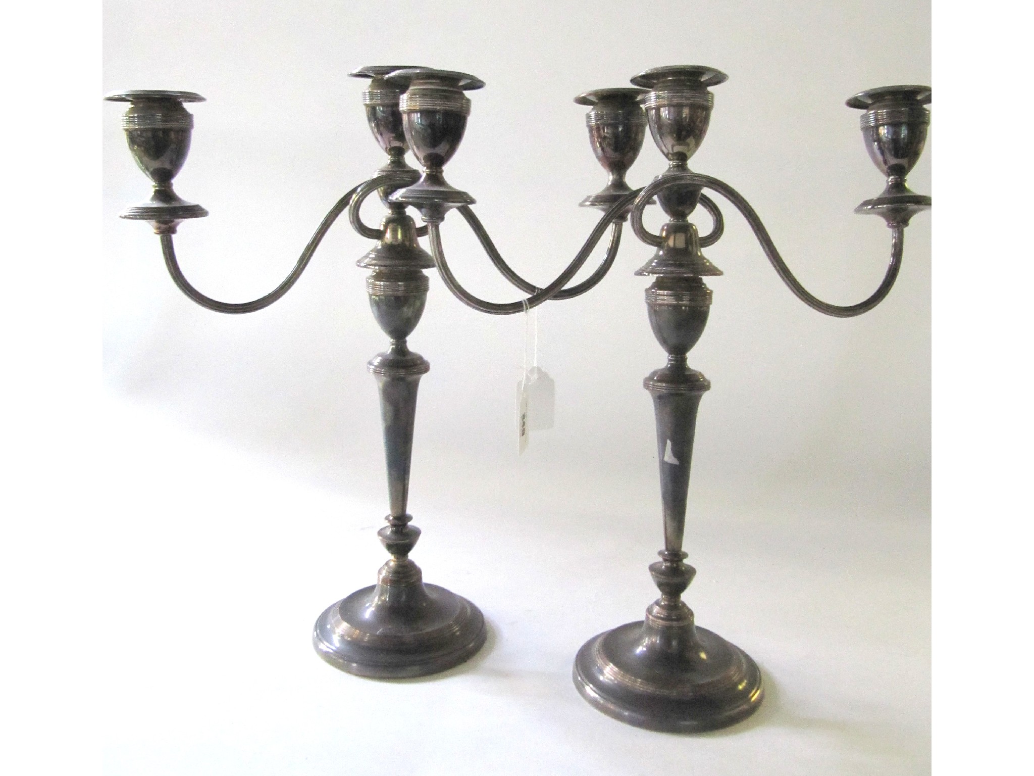 Appraisal: A pair of silver plated candelabra