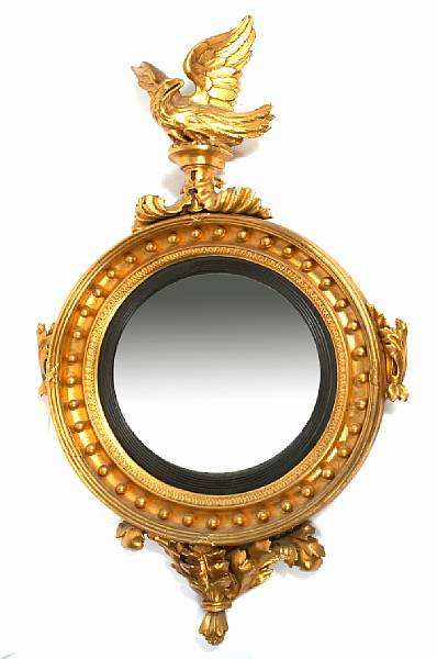 Appraisal: A Centennial giltwood and ebonized mirror with carved eagle decoration