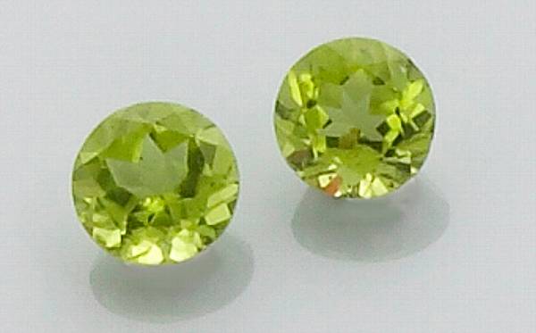 Appraisal: Pair of Peridots Pakistan An attractive pair of circular-cut peridots