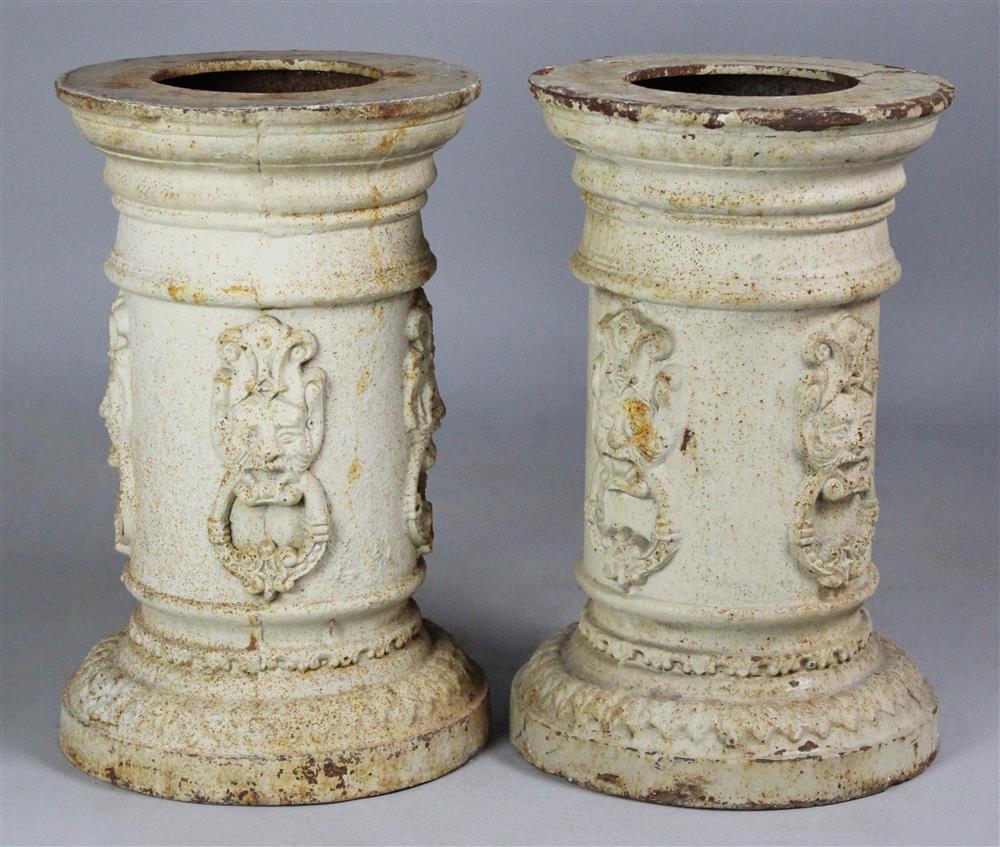 Appraisal: PAIR OF CAST IRON PEDESTAL COLUMNS each cast with masks