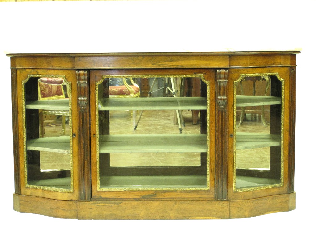 Appraisal: A th Century rosewood Credenza with marble top fitted three