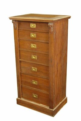 Appraisal: A late Victorian walnut Wellington chest of seven graduated drawers