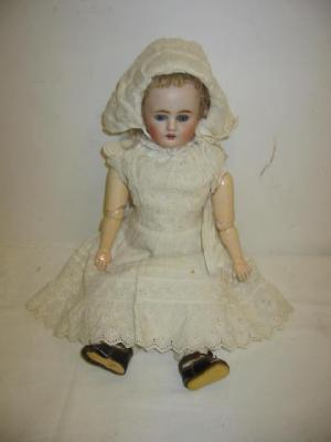 Appraisal: A Kestner bisque shoulder head doll with fixed blue eyes