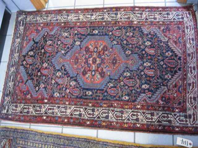 Appraisal: Hamadan Persian Handmade Rug elaborate designs primarily reds blues ivory