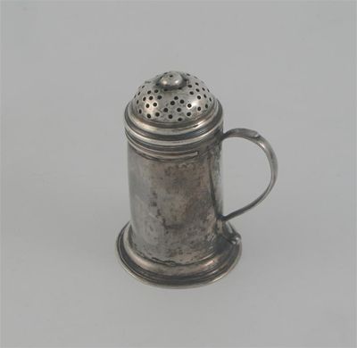 Appraisal: A George II provincial kitchen pepper with a domed spreading