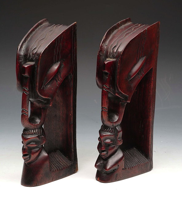 Appraisal: A PAIR OF AFRICAN CARVED WOODEN BOOK ENDS with figure