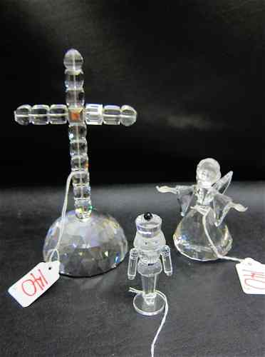 Appraisal: THREE SWAROVSKI CUT CRYSTAL FIGURINES ''Cross of Light '' designed