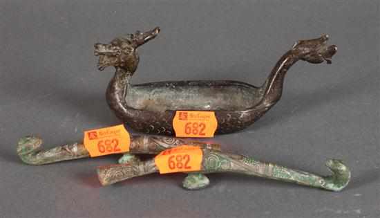 Appraisal: Two Chinese brass and inlaid bronze cloak hooks and a