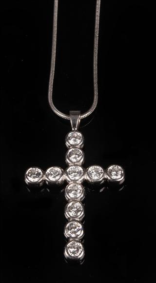 Appraisal: A diamond cross by Theo Fennell rub over set throughout