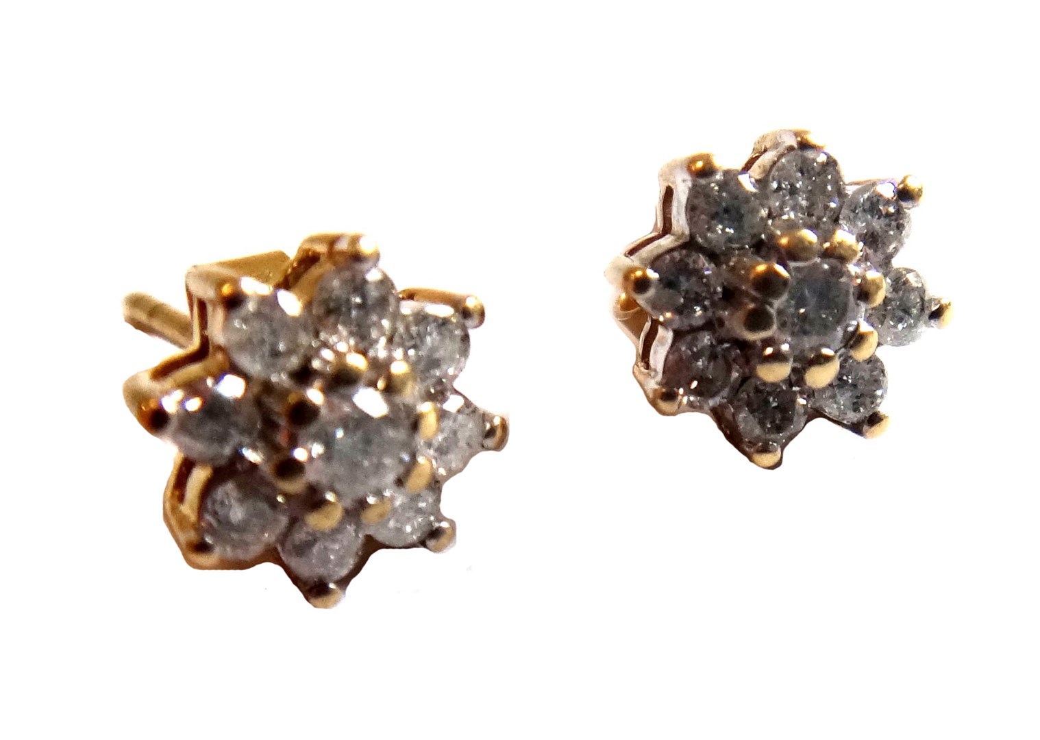 Appraisal: A pair of gold and diamond set nine stone cluster