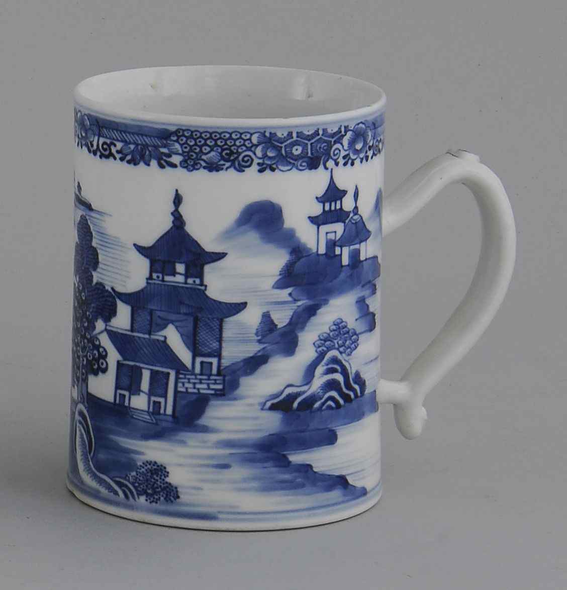 Appraisal: CHINESE EXPORT PORCELAIN STRAP-HANDLE MUGEarly th CenturyWith blue and white