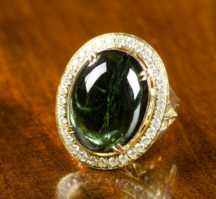 Appraisal: GREEN TOURMALINE AND FOURTEEN KARAT GOLD RING The heavy yellow