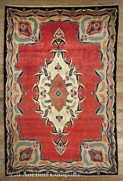 Appraisal: A Persian Tabriz Carpet red ground bold geometric central medallion