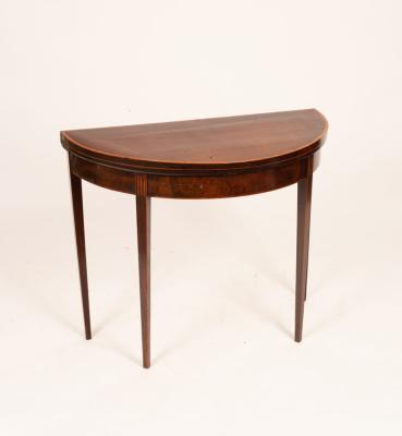 Appraisal: A George III mahogany card table crossbanded and on square