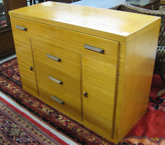 Appraisal: AMERICAN MID-CENTURY MODERN BUFFET of yellow mahogany construction the front