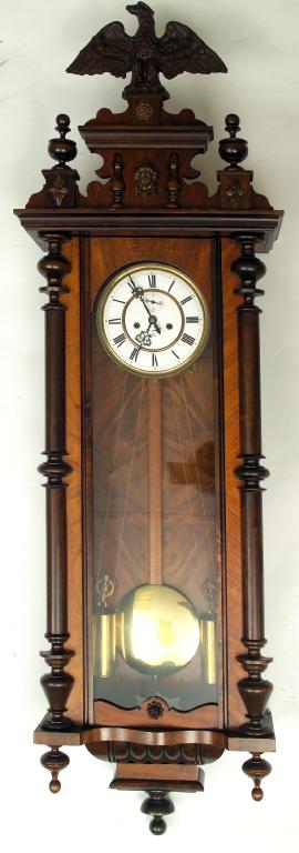 Appraisal: ATTRACTIVE HONEY WALNUT AND STAINED WOOD WALL CLOCK IN THE