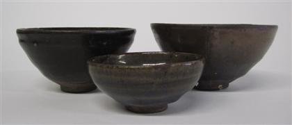 Appraisal: Three Chinese brown glazed pottery bowlsDeep U-shape brown and oil