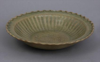 Appraisal: CENTRAL THAI SAWANKALOKE INCISED CELADON FOOTED BOWL The interior with