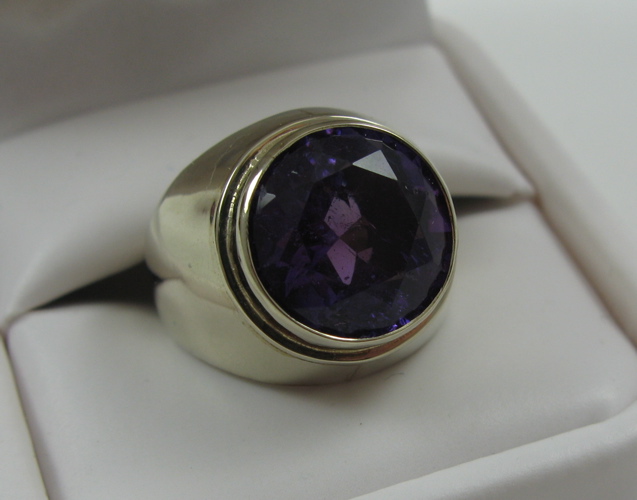 Appraisal: AMETHYST SOLITAIRE RING with K gold bezel setting the estimated