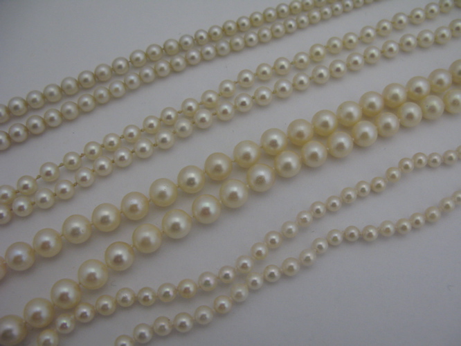 Appraisal: FOUR PEARL AND KARAT WHITE GOLD NECKLACES ranging in length