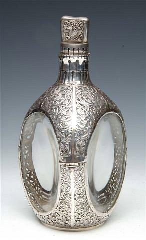 Appraisal: A WHITE METAL DECANTER - glass bottle covered with pierced