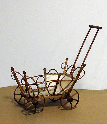 Appraisal: Doll carriage Natural bent willow open weave carriage with single