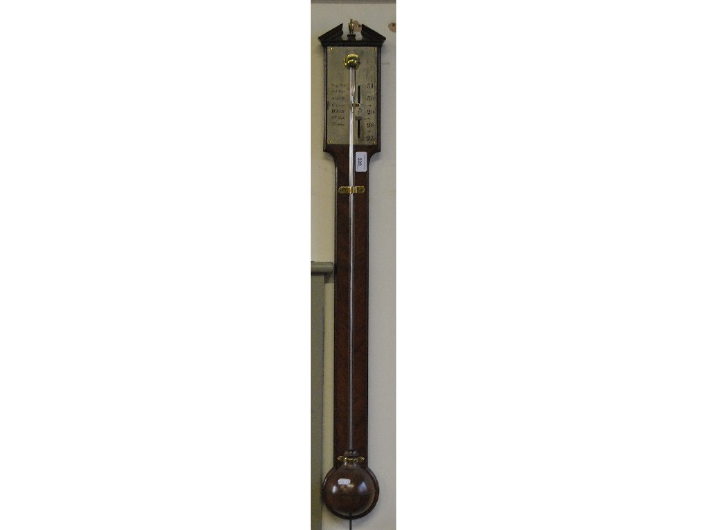 Appraisal: A th century mahogany stick barometer having a silvered register